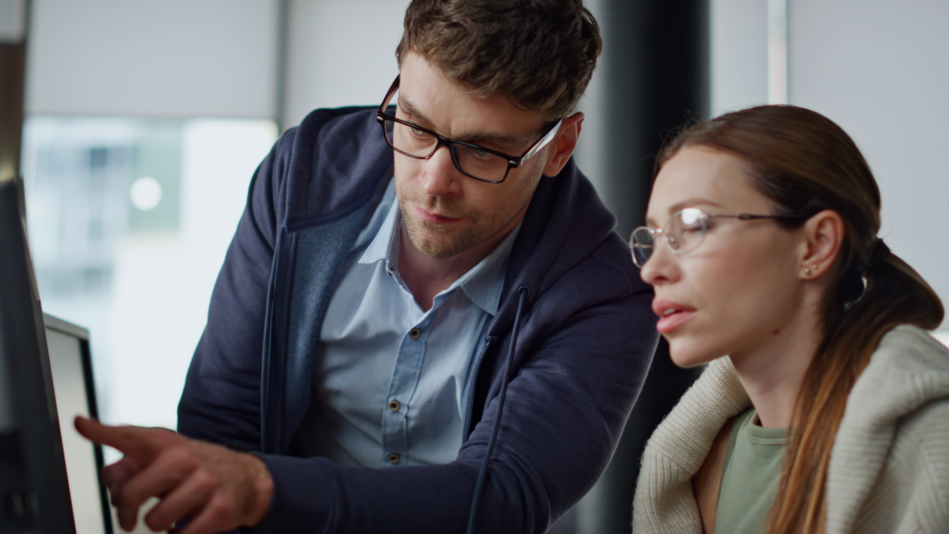 Two searchers working a deal on screen together