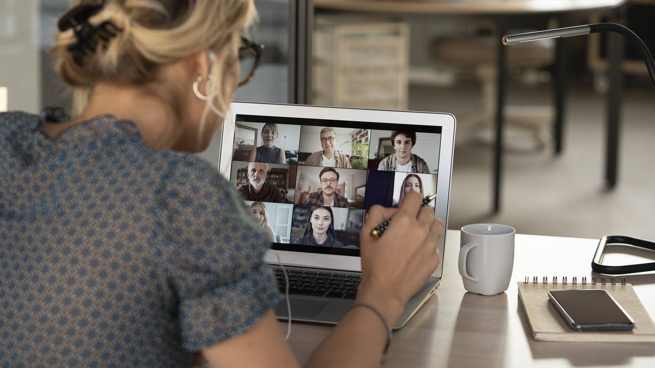 A member on a live video session, the room on screen